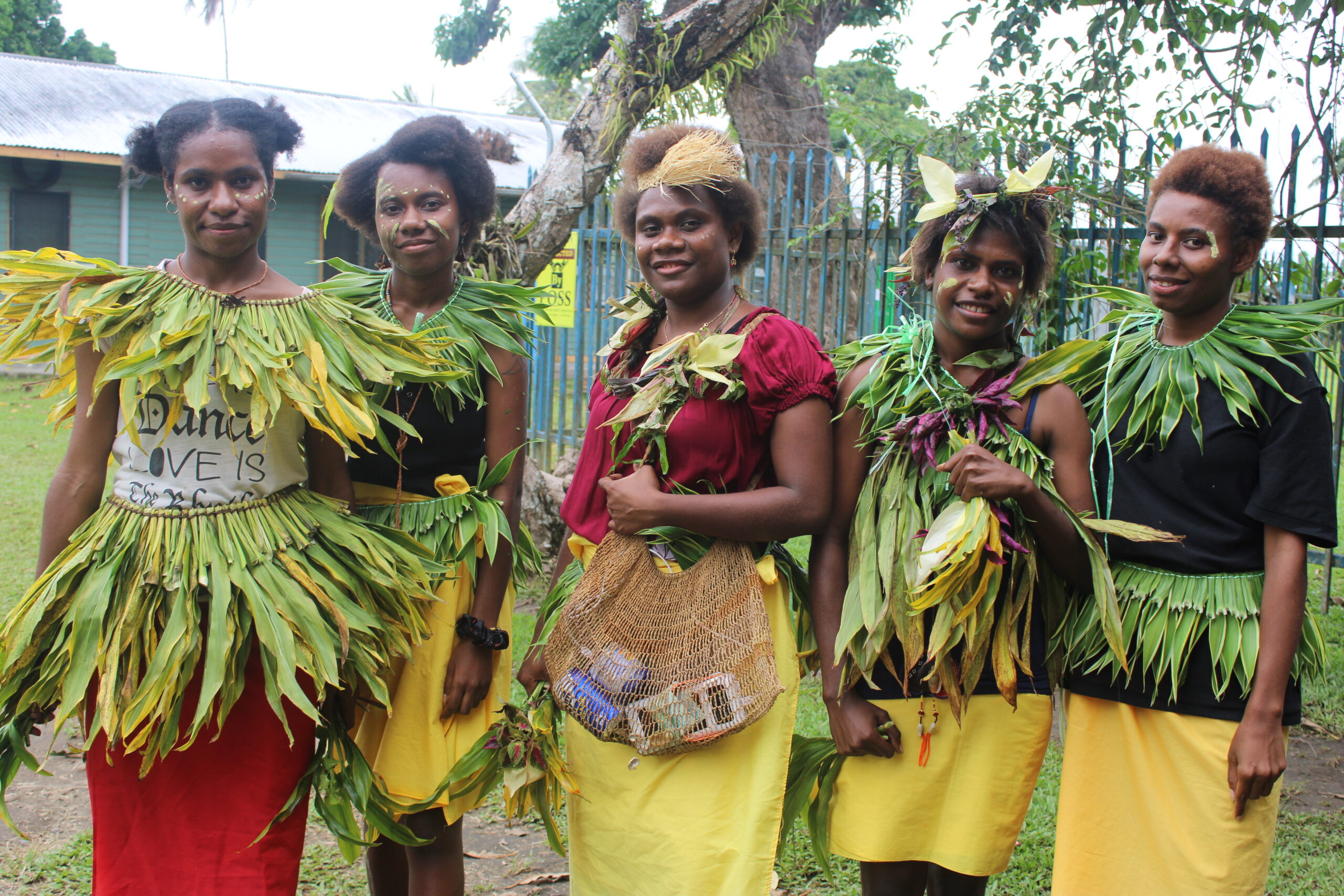 Students dressed in traditional clothes ready to perform a dance at Chanel Day